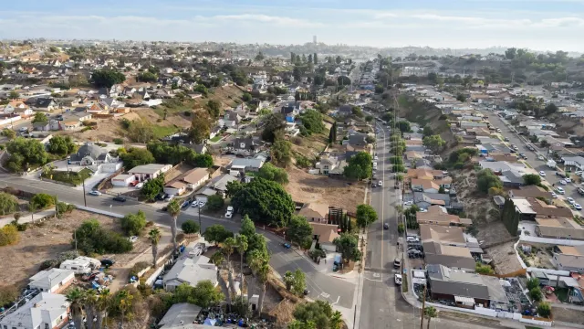an aerial view of residential houses with outdoor space