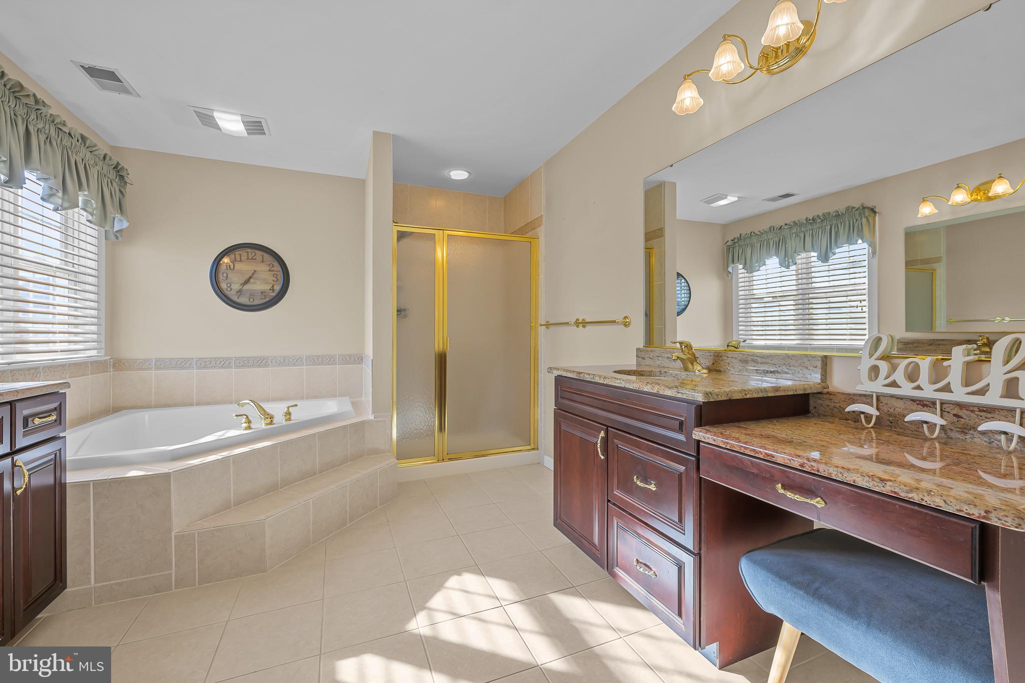 305 Williamson Way Downingtown, PA 19335 - Photo 24 of 60 a spacious bathroom with a granite countertop tub sink and mirror