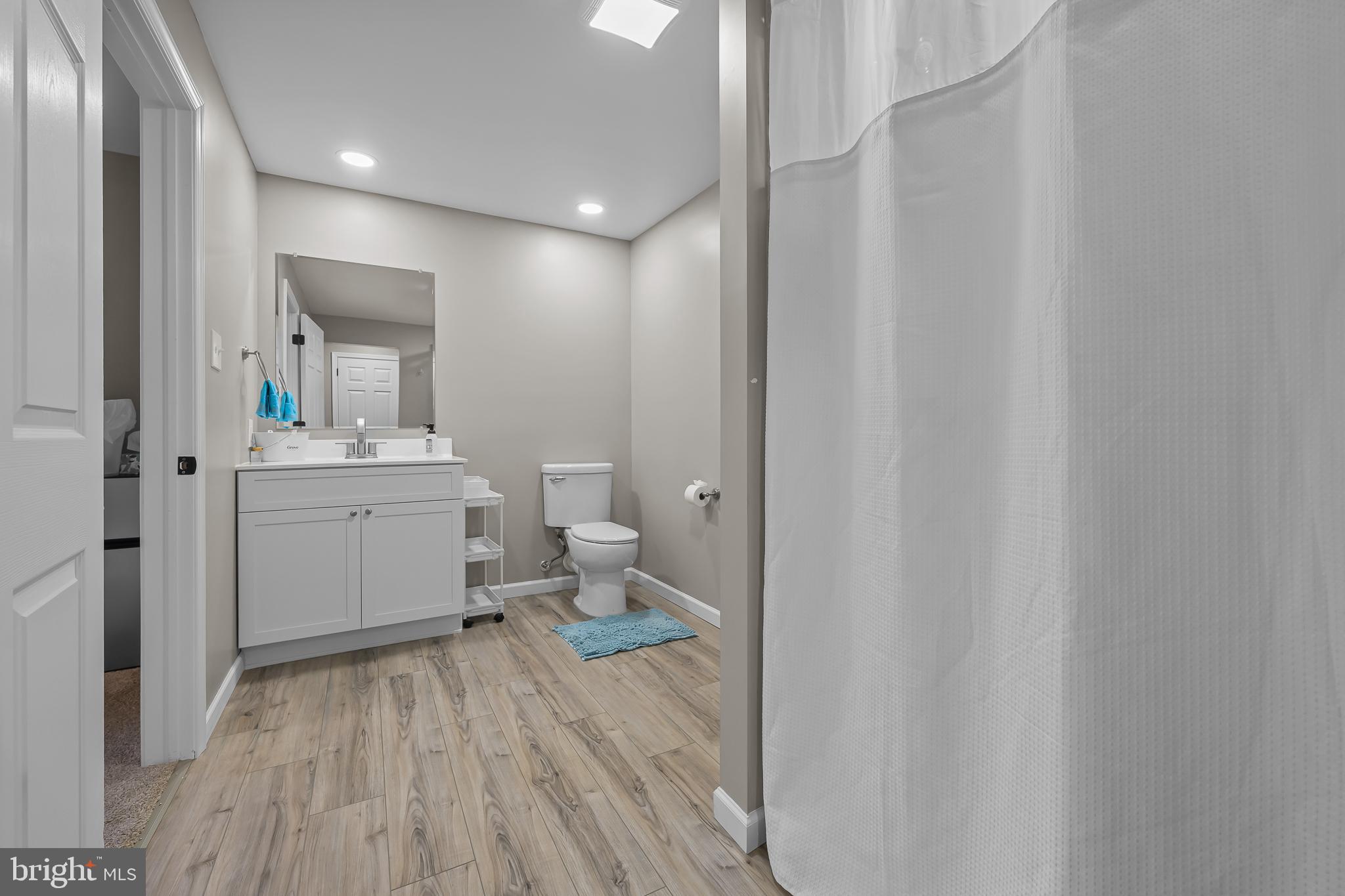 305 Williamson Way Downingtown, PA 19335 - Photo 38 of 60 a bathroom with a sink a toilet and a mirror