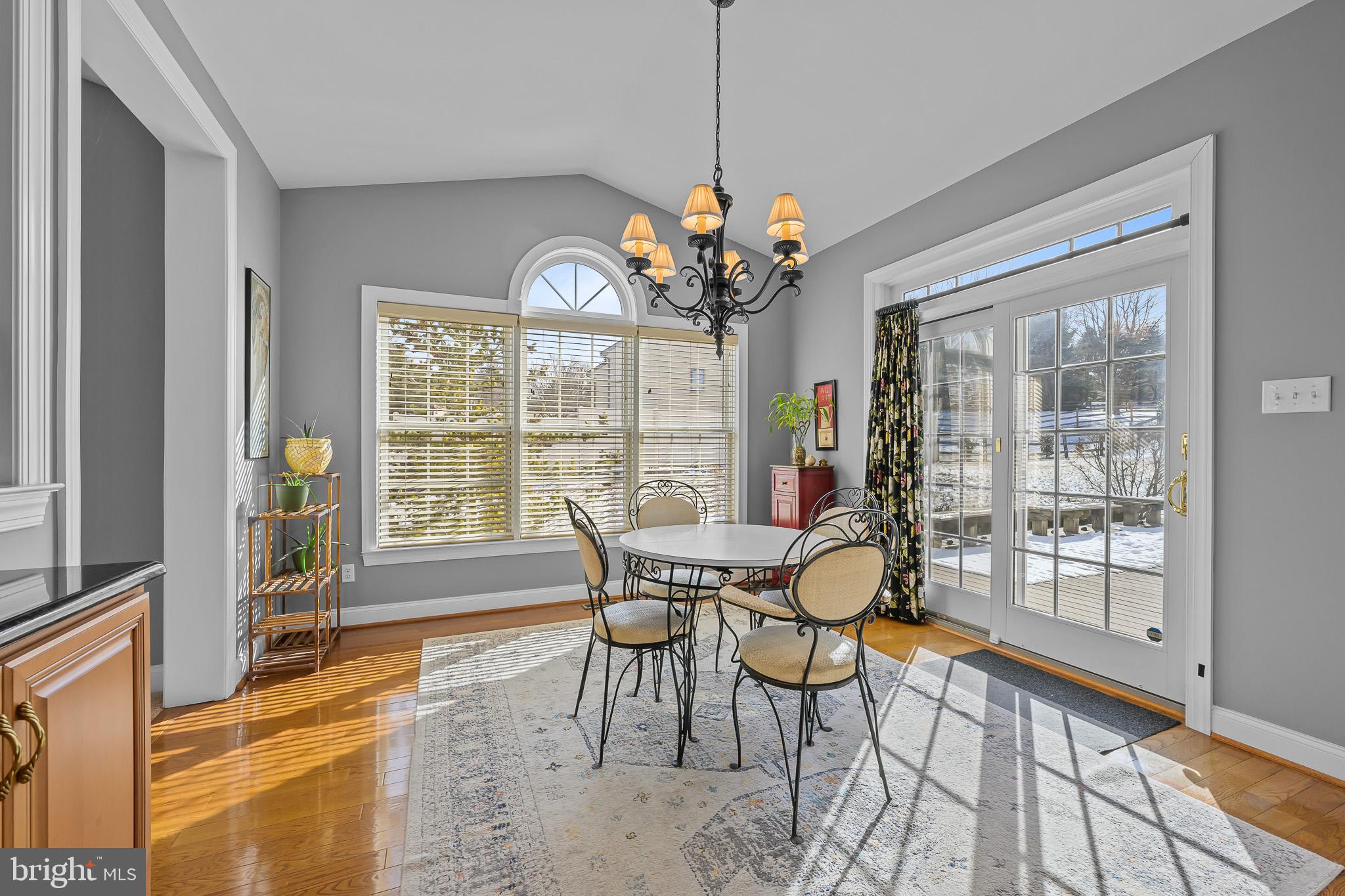 305 Williamson Way Downingtown, PA 19335 - Photo 9 of 60 a dining room with furniture a chandelier and wooden floor