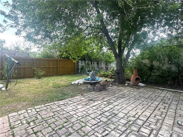 a view of a bench in a backyard