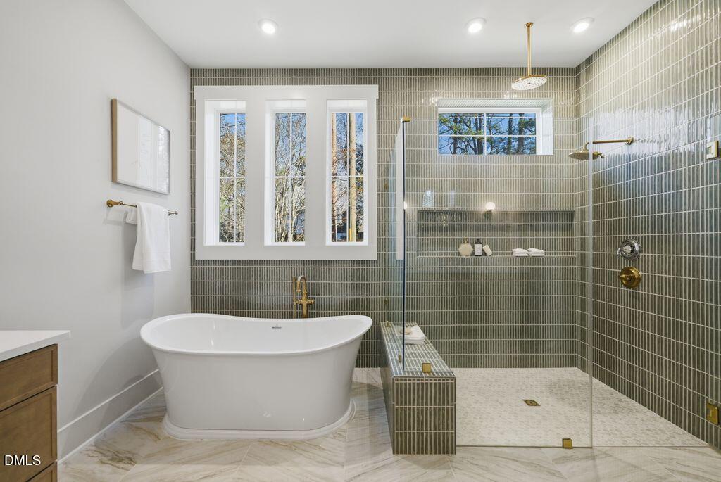 1500 Shadowood Lane Raleigh, NC 27612 - Photo 10 of 39 a bathroom with a bathtub and a shower