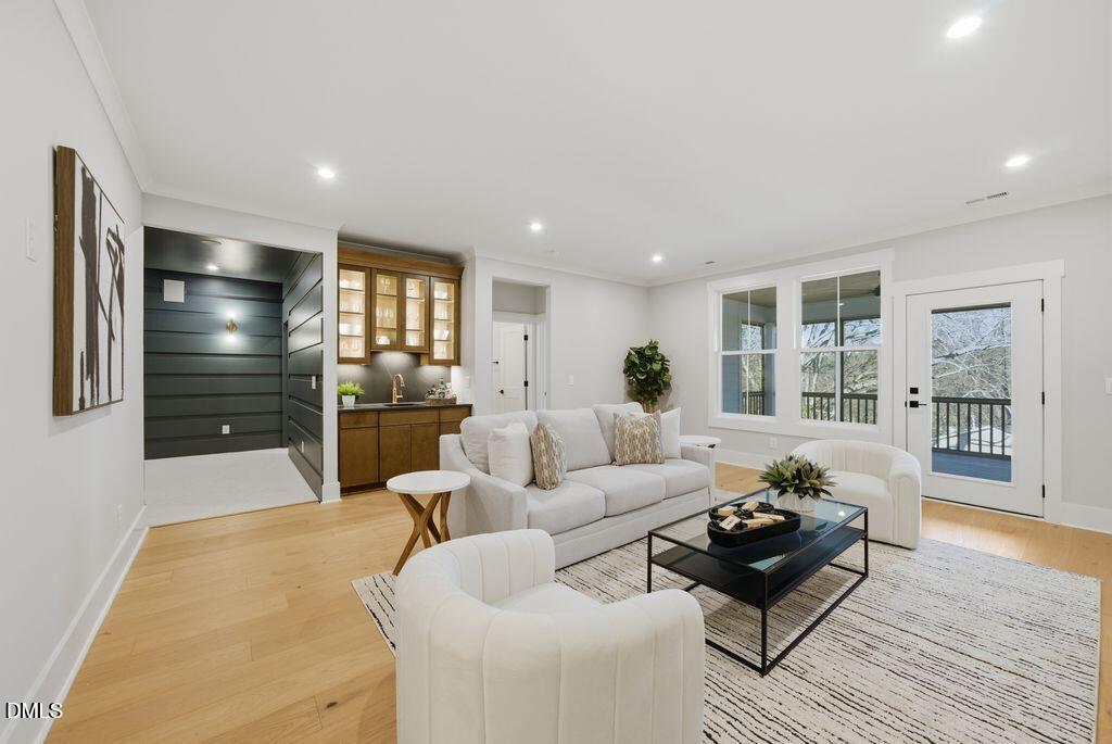 1500 Shadowood Lane Raleigh, NC 27612 - Photo 16 of 39 a living room with furniture fireplace and wooden floor