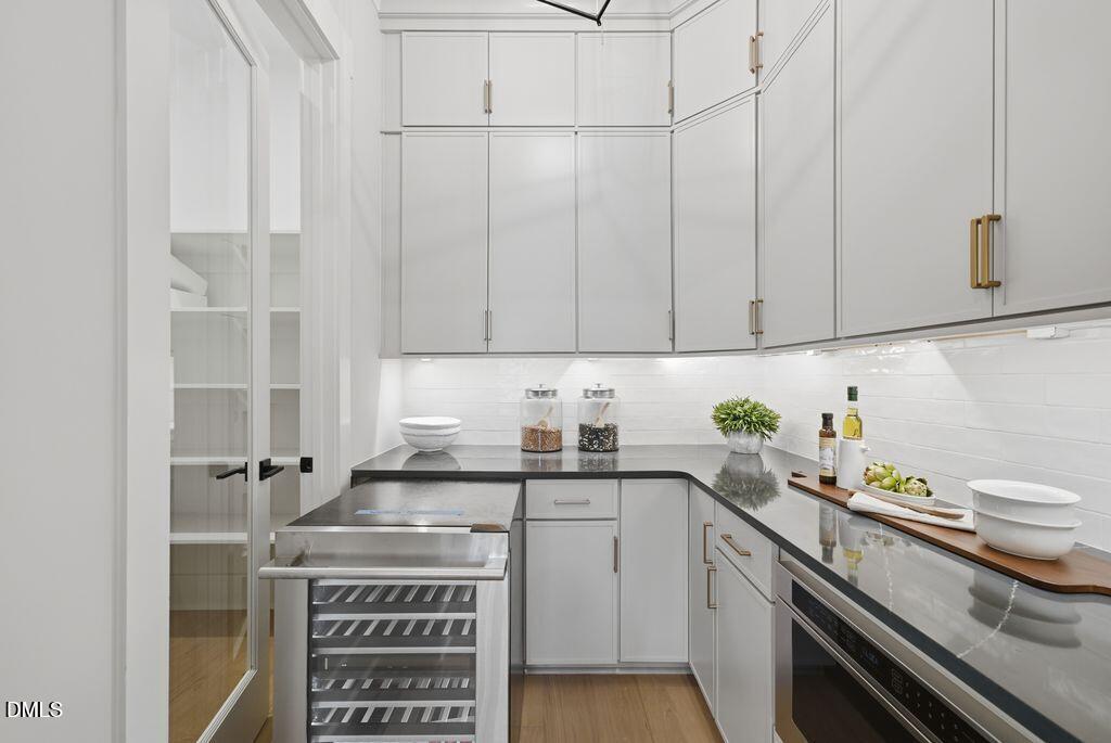 1500 Shadowood Lane Raleigh, NC 27612 - Photo 19 of 39 a kitchen with stainless steel appliances a cabinets and a stove top oven