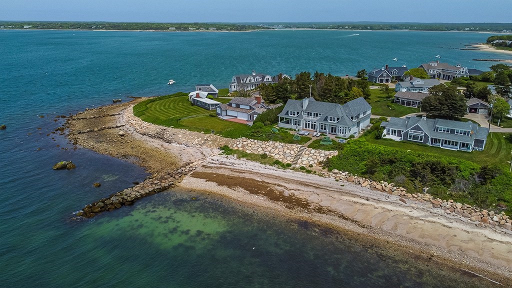 35 Sunset Point Road Falmouth, MA 02556 - Photo 1 of 27 an aerial view of a house with a garden and lake view