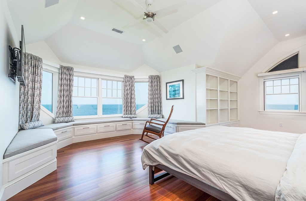35 Sunset Point Road Falmouth, MA 02556 - Photo 14 of 27 a spacious bedroom with a large bed and a large window