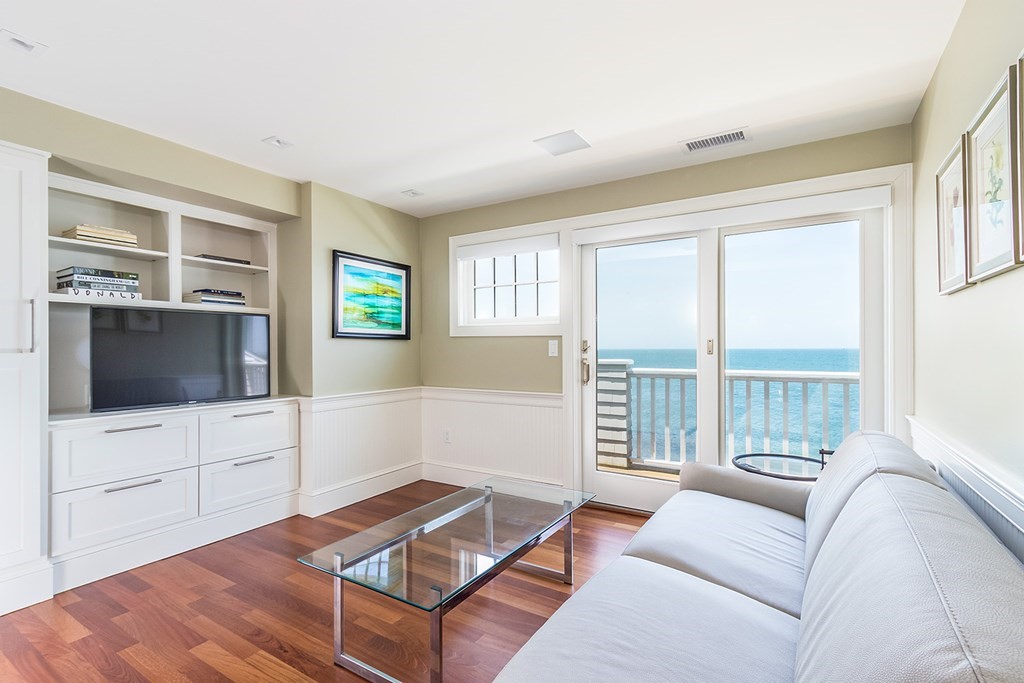 35 Sunset Point Road Falmouth, MA 02556 - Photo 17 of 27 a living room with furniture and a flat screen tv