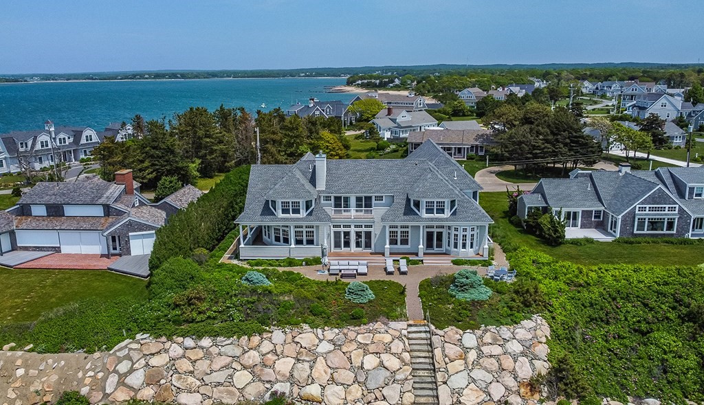 35 Sunset Point Road Falmouth, MA 02556 - Photo 2 of 27 an aerial view of a house with a garden and lake view