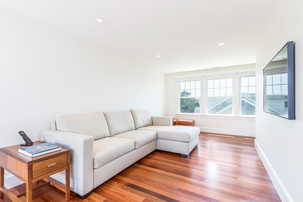 35 Sunset Point Road Falmouth, MA 02556 - Photo 21 of 27 a living room with furniture and a large window