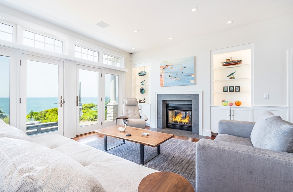 35 Sunset Point Road Falmouth, MA 02556 - Photo 5 of 27 a living room with furniture and a fireplace