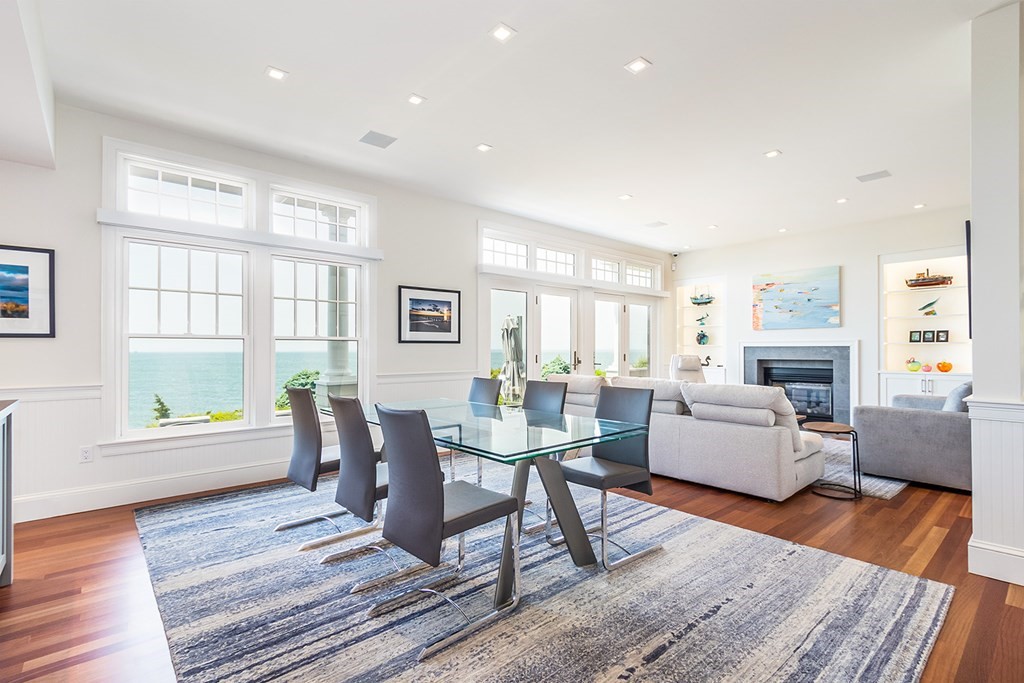 35 Sunset Point Road Falmouth, MA 02556 - Photo 6 of 27 a living room with fireplace furniture wooden floor and a table