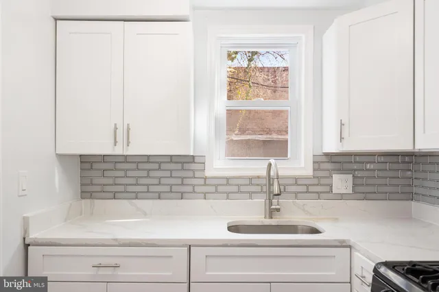 a kitchen with a sink and a window