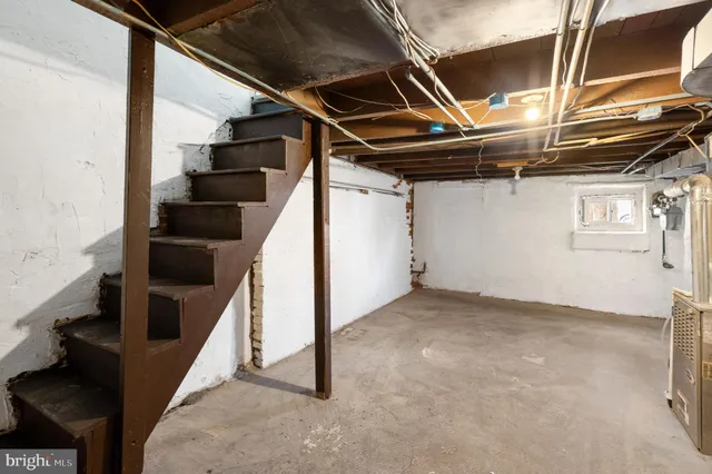 a view of an empty room with stairs