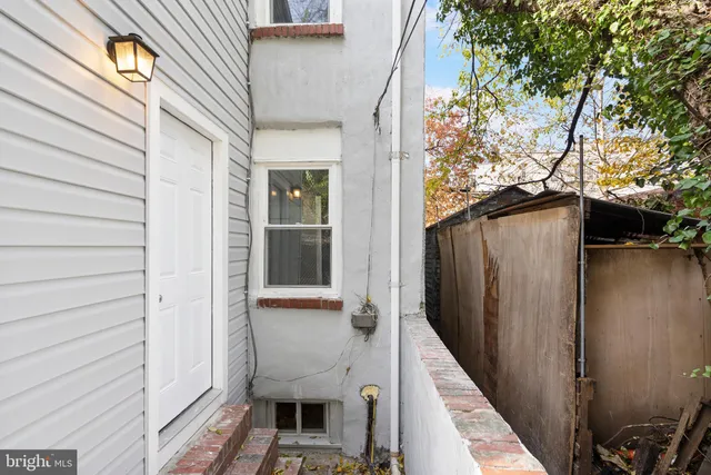 a view of road with card parked