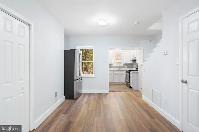 a view of a kitchen cabinets and wooden floor