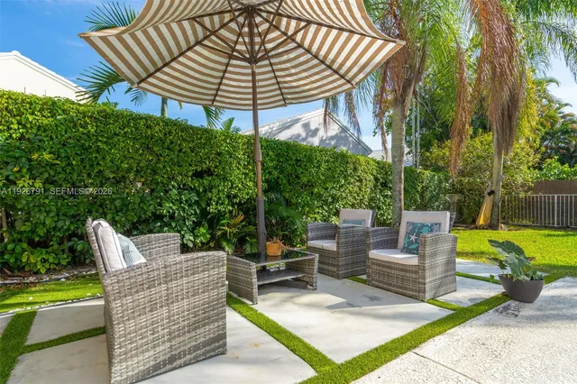 a view of a patio with a yard