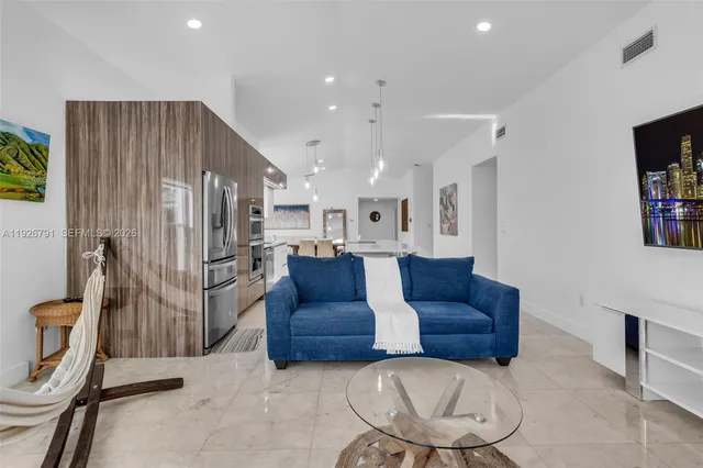 a living room with a couch and a flat screen tv