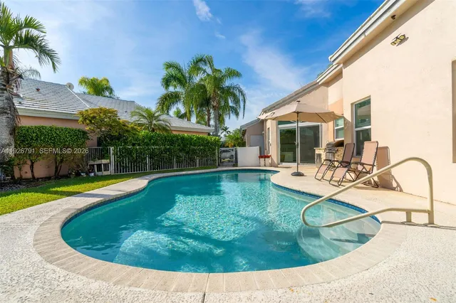 a view of a swimming pool with a patio