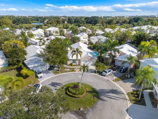 an aerial view of residential houses with outdoor space