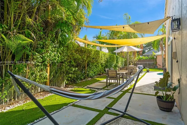 a view of swimming pool with a lounge chair