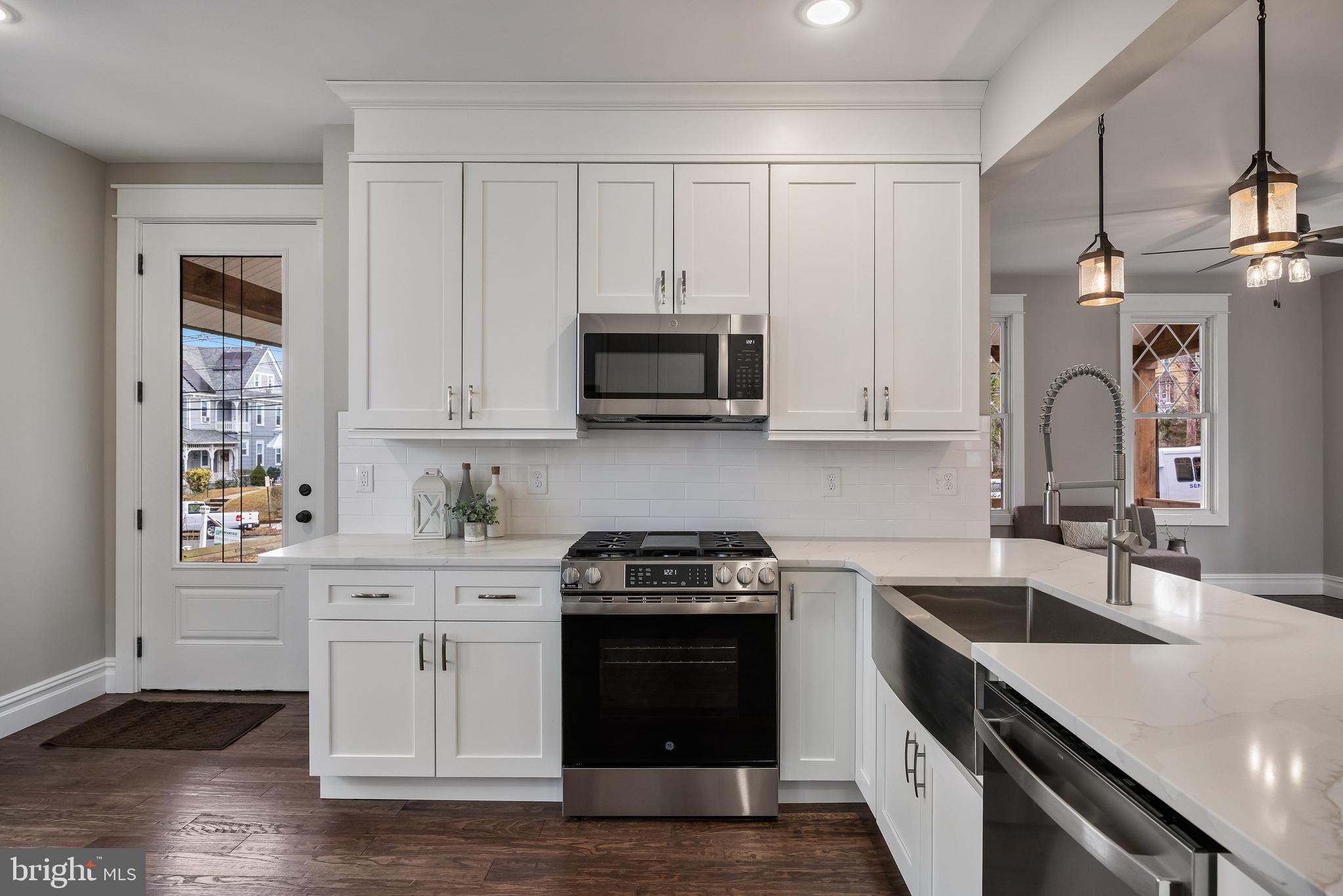 52 Madison Avenue Mount Holly, NJ 08060 - Photo 17 of 53 a kitchen with stainless steel appliances granite countertop a stove a sink and a microwave