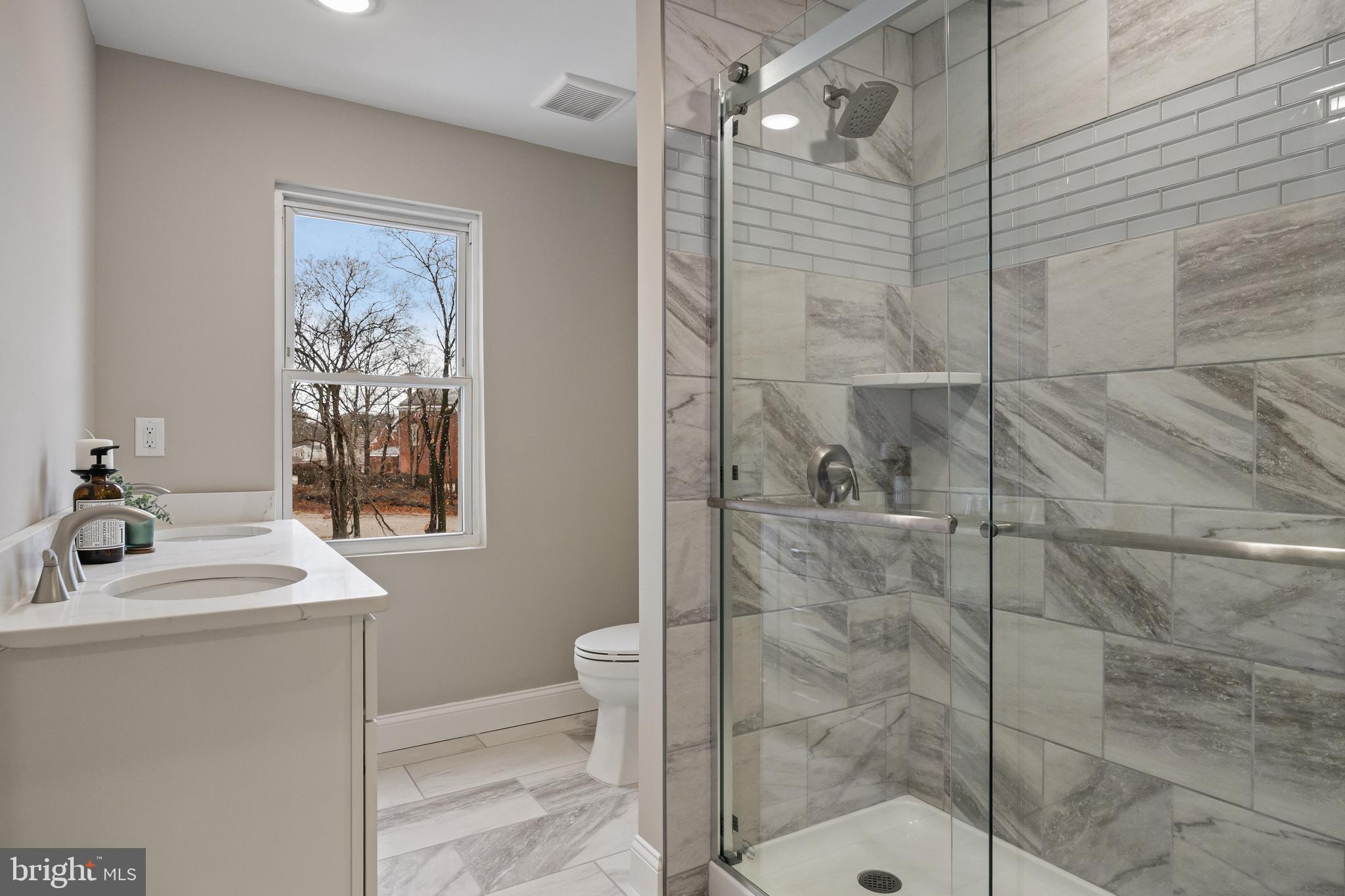 52 Madison Avenue Mount Holly, NJ 08060 - Photo 25 of 53 a bathroom with a sink toilet and shower