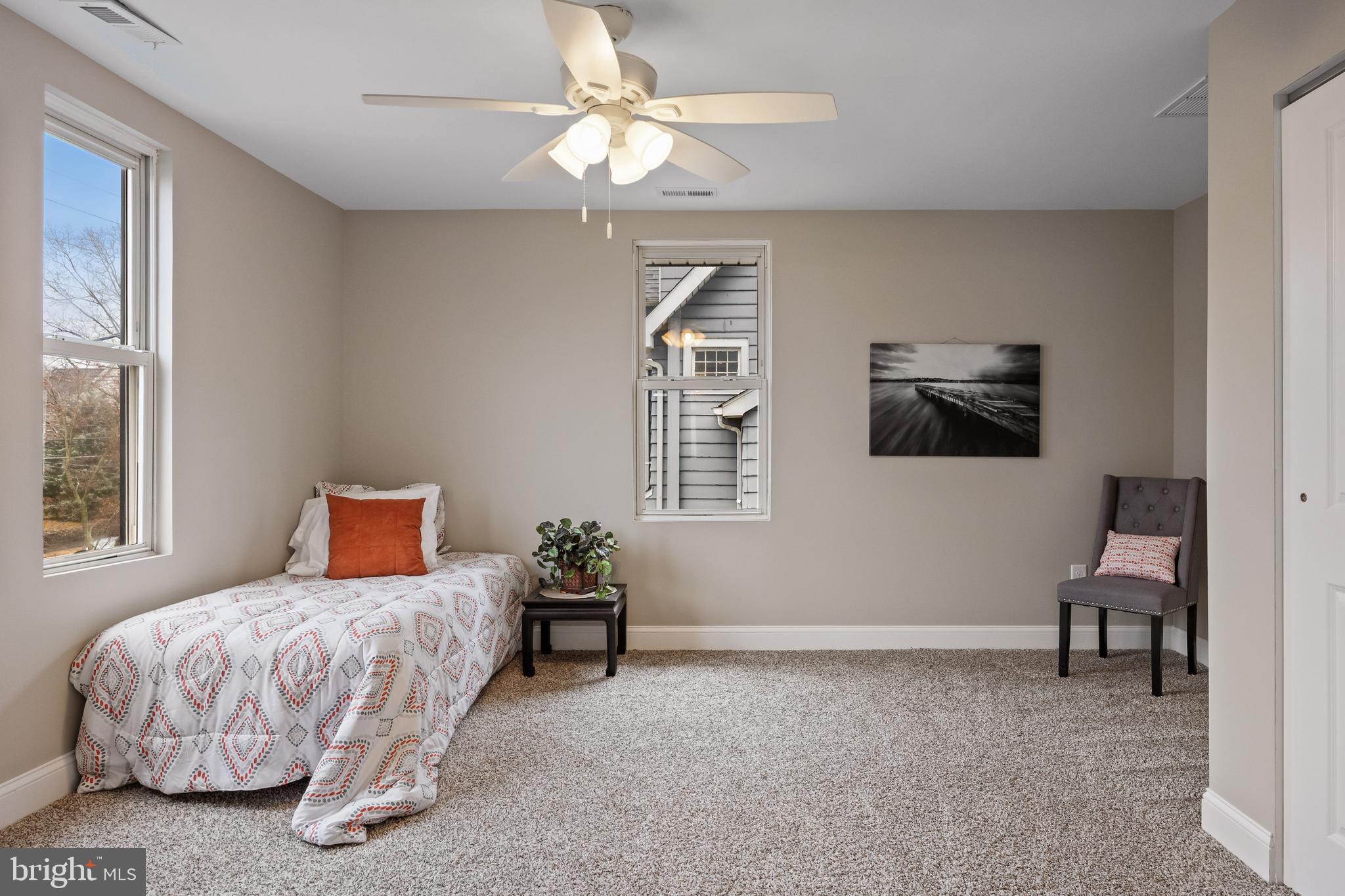 52 Madison Avenue Mount Holly, NJ 08060 - Photo 27 of 53 a bedroom with a bed and a chandelier
