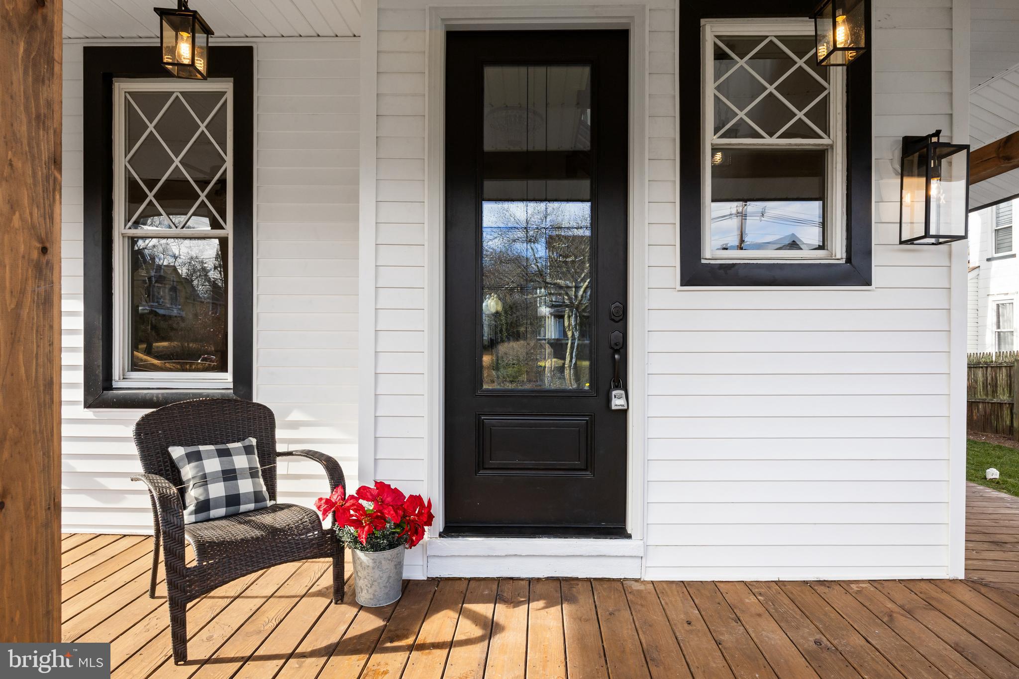52 Madison Avenue Mount Holly, NJ 08060 - Photo 3 of 53 a vase of flowers sitting on a wooden floor