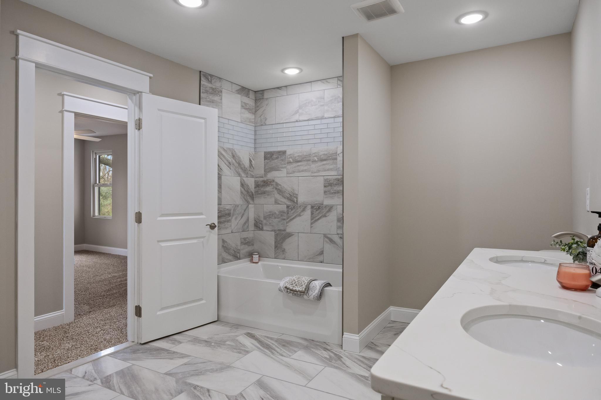 52 Madison Avenue Mount Holly, NJ 08060 - Photo 31 of 53 a bathroom with a sink and a tub