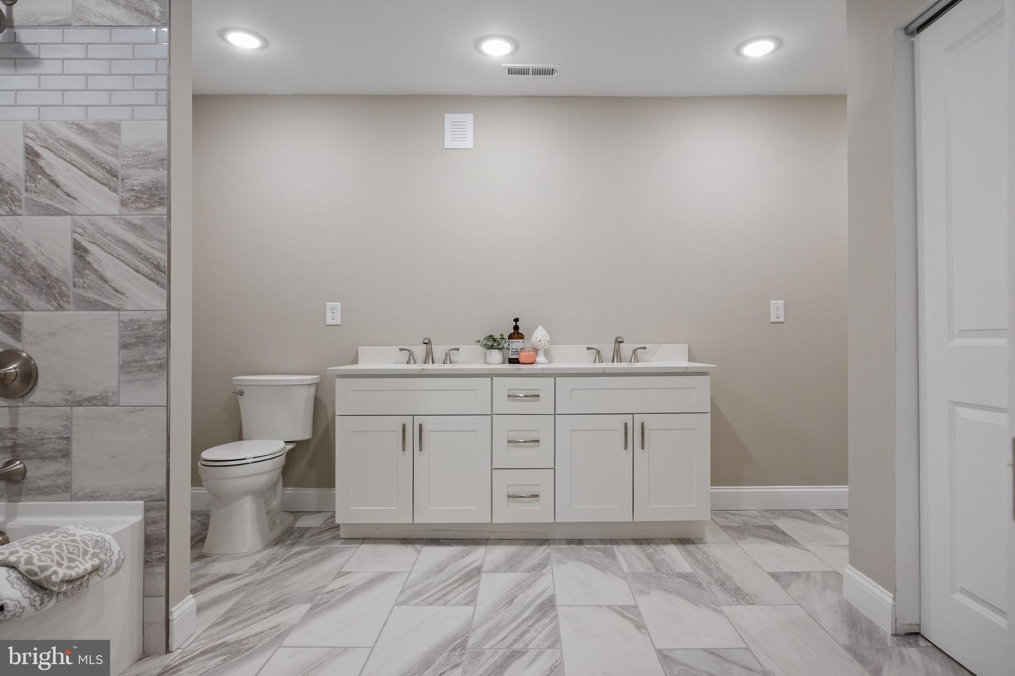 52 Madison Avenue Mount Holly, NJ 08060 - Photo 32 of 53 a bathroom with a sink vanity and a toilet