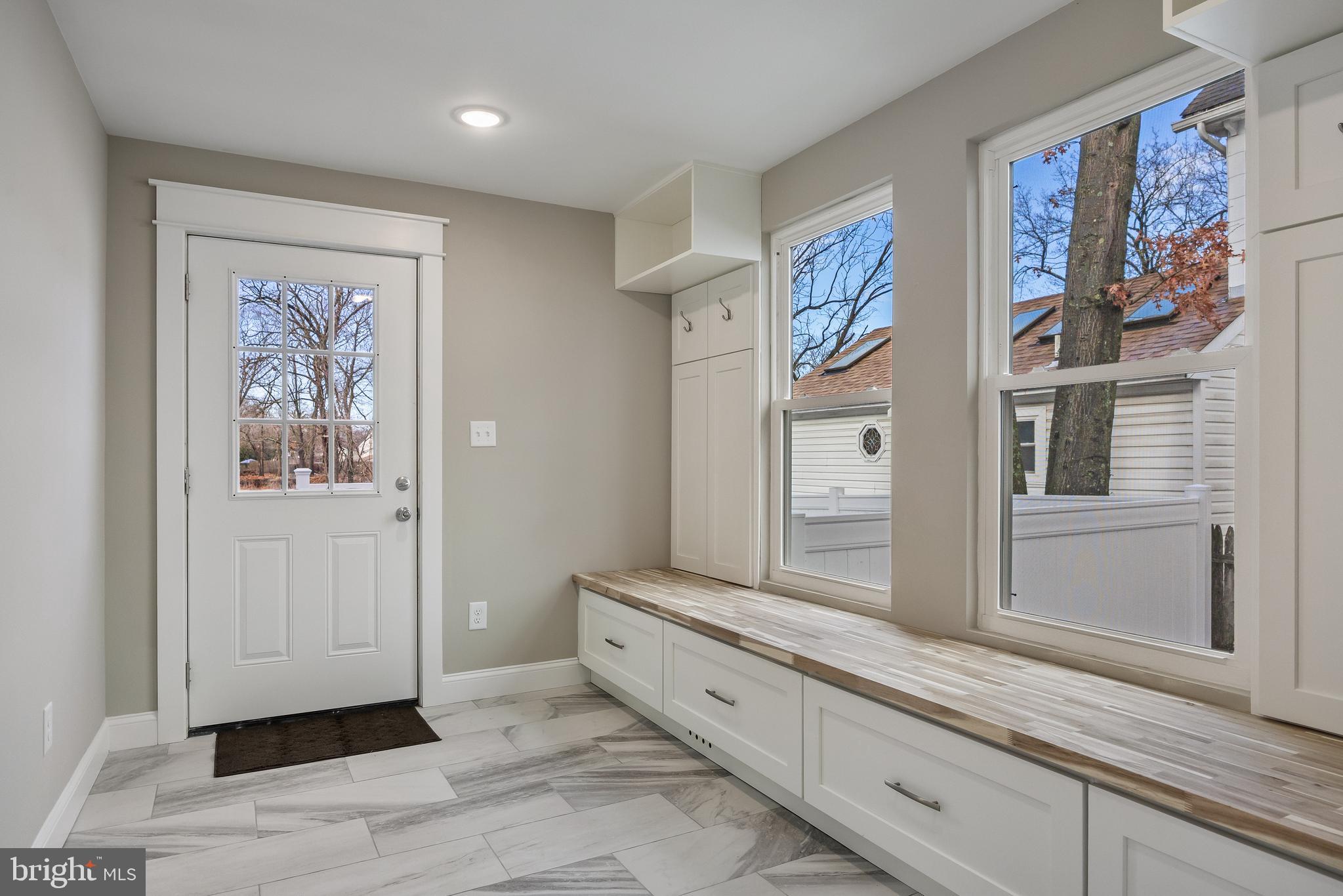 52 Madison Avenue Mount Holly, NJ 08060 - Photo 41 of 53 a hallway with painting on the wall and a large mirror