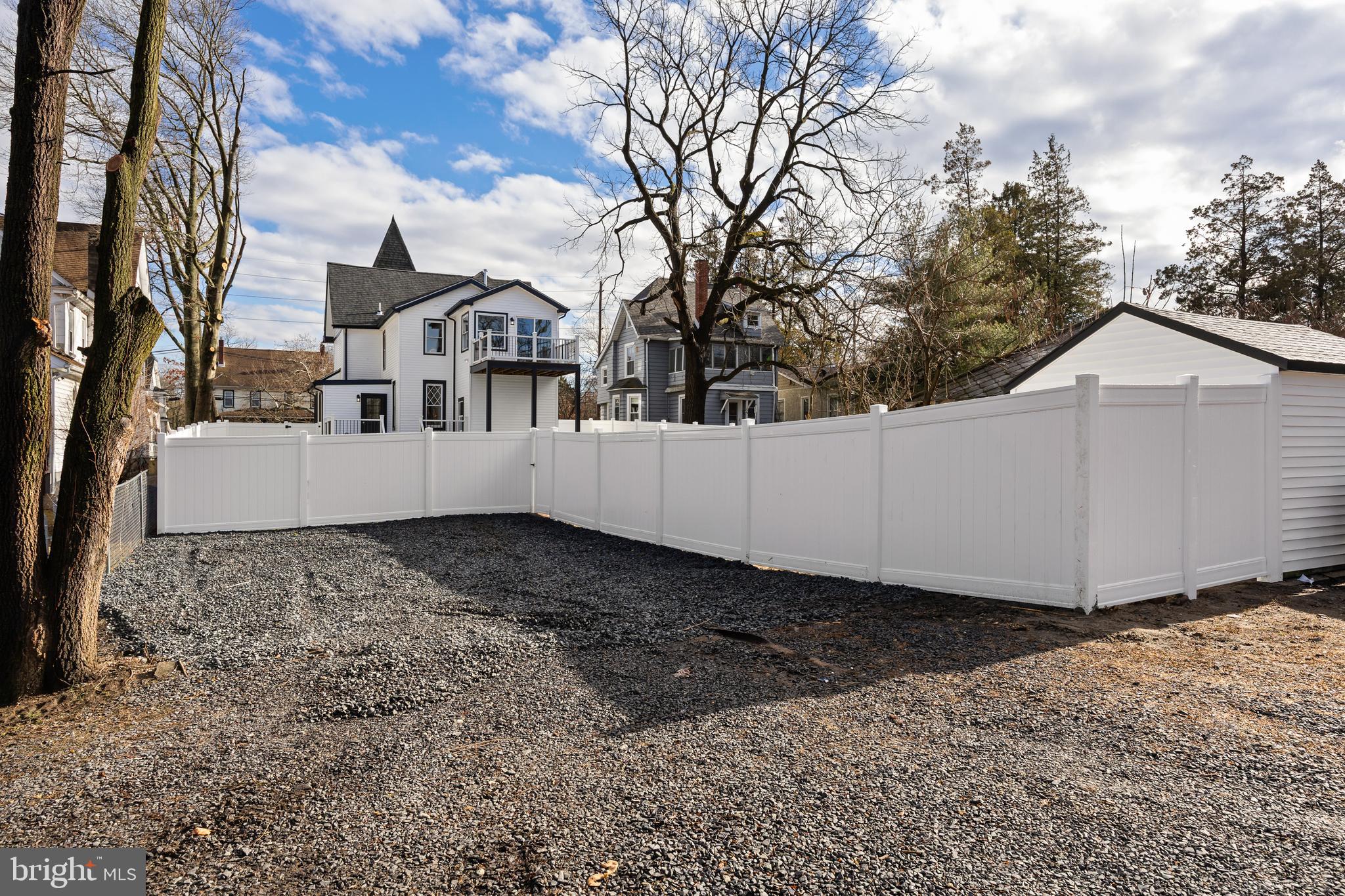 52 Madison Avenue Mount Holly, NJ 08060 - Photo 46 of 53 a view of a white house with a yard covered in snow