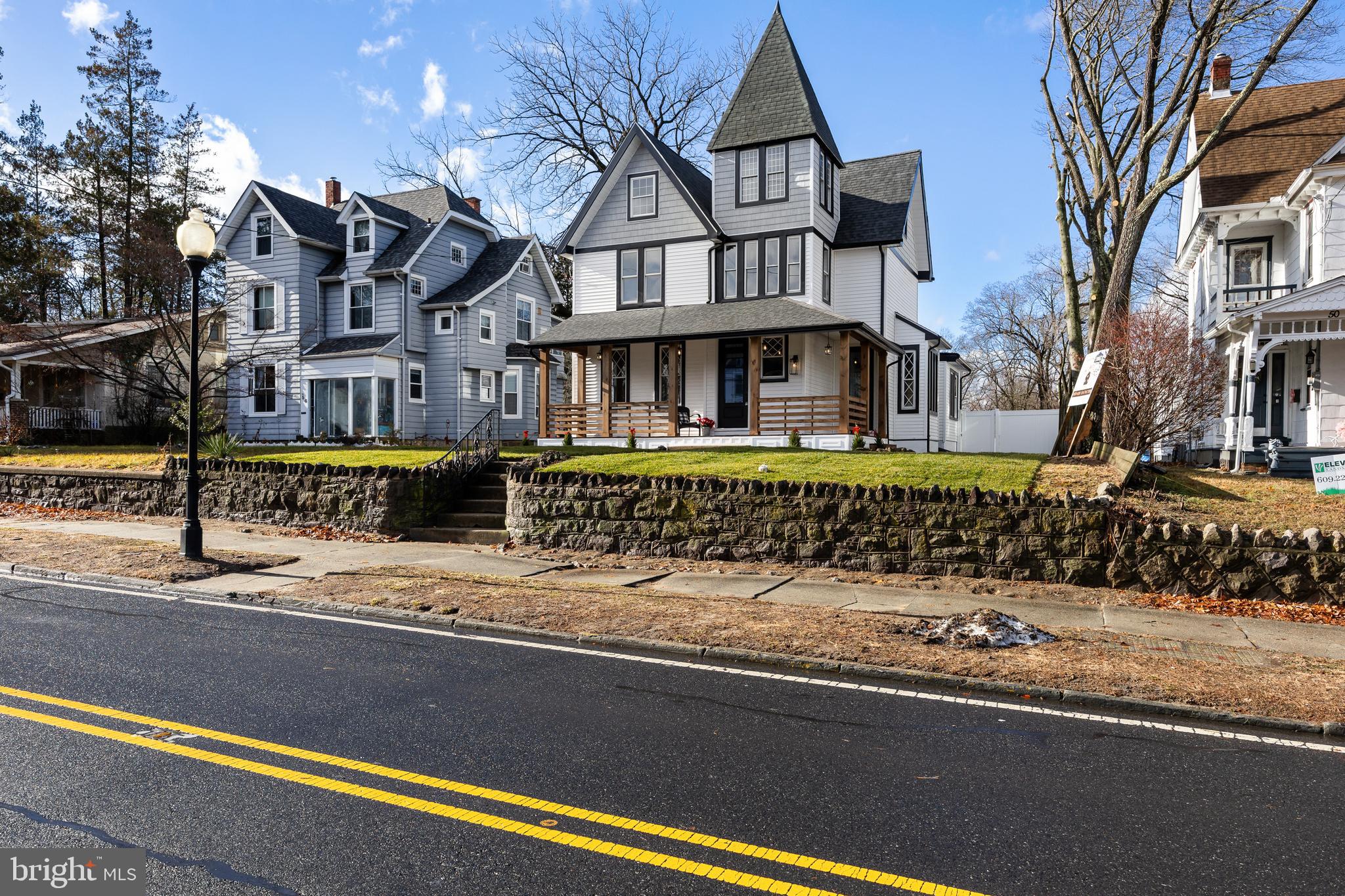 52 Madison Avenue Mount Holly, NJ 08060 - Photo 47 of 53 a front view of residential houses with street