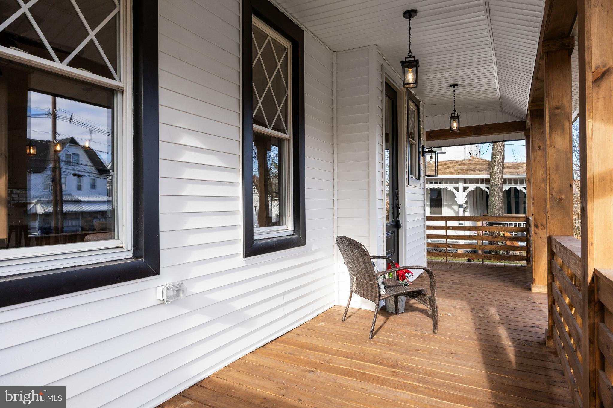 52 Madison Avenue Mount Holly, NJ 08060 - Photo 5 of 53 a view of a balcony and chairs and wooden floor