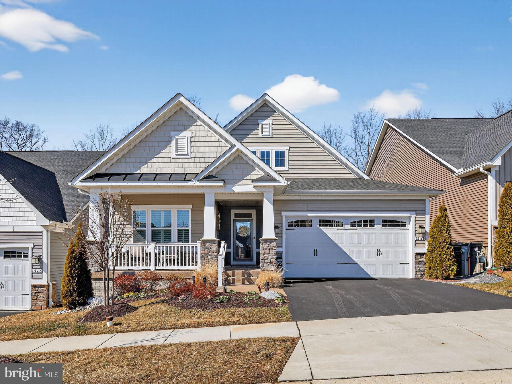 1534 Catbriar Way Odenton, MD 21113 - Photo 1 of 1 a front view of a house with a yard and garage