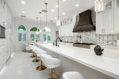 a bathroom with a double vanity sink and mirror with shower