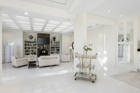 a spacious bathroom with a double vanity sink mirror and bathtub