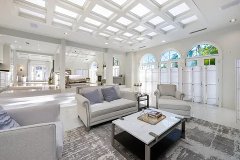 a view of a patio with a dining table and chairs with a fire pit