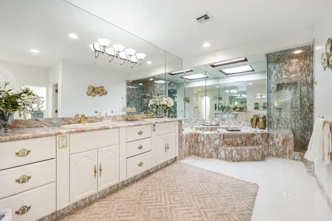 a view of a house with swimming pool and a yard