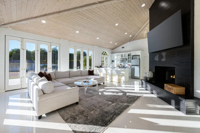 a view of a house with a garden and a yard