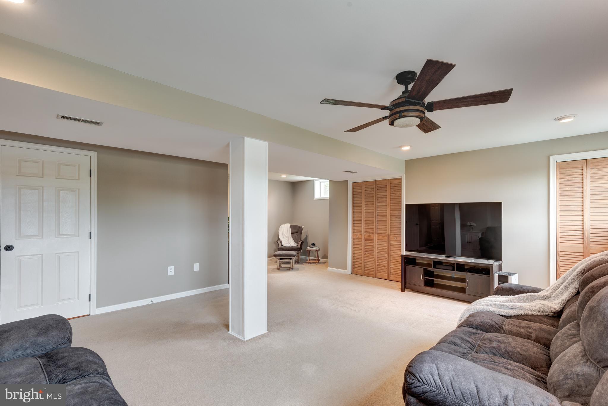 312 Inverness Close Westminster, MD 21158 - Photo 23 of 36 a living room with furniture and a flat screen tv