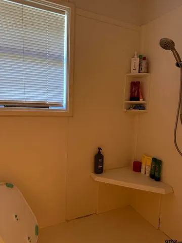 a bathroom with a sink and a window