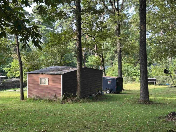 a view of backyard with green space