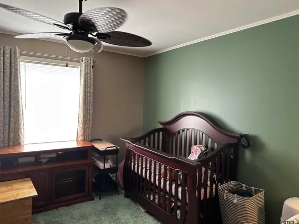 a bedroom with furniture and a window