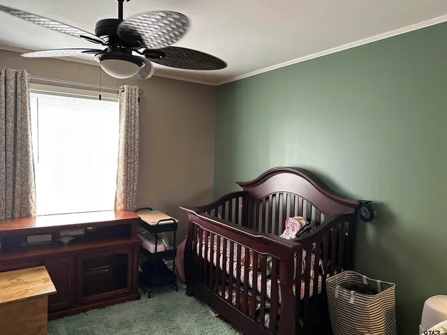 a bedroom with furniture and a window