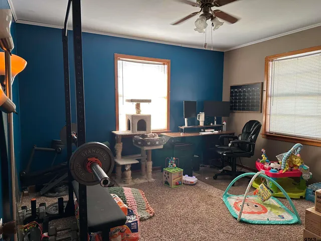 a room with furniture a chandelier and a window