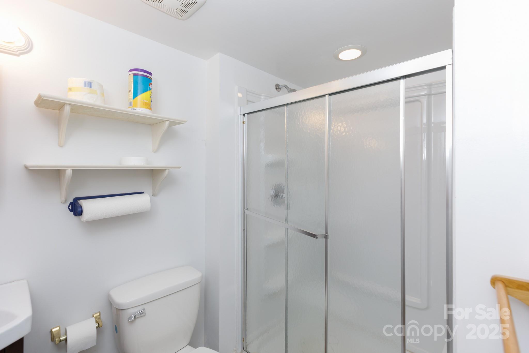 3199 Harmony Road Catawba, SC 29704 - Photo 34 of 46 a bathroom with a shower a toilet and a sink