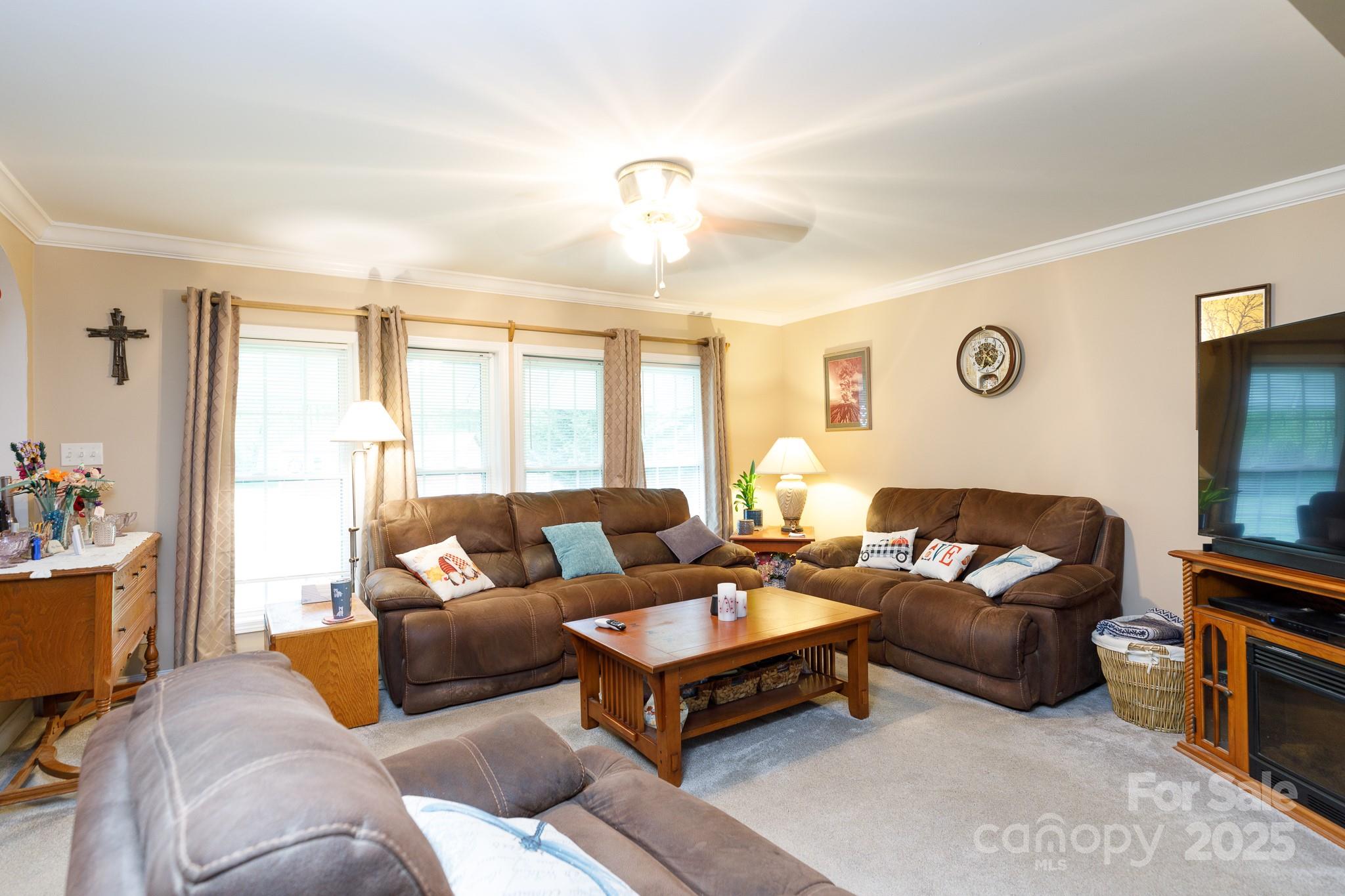 3199 Harmony Road Catawba, SC 29704 - Photo 7 of 46 a living room with furniture a flat screen tv and a window
