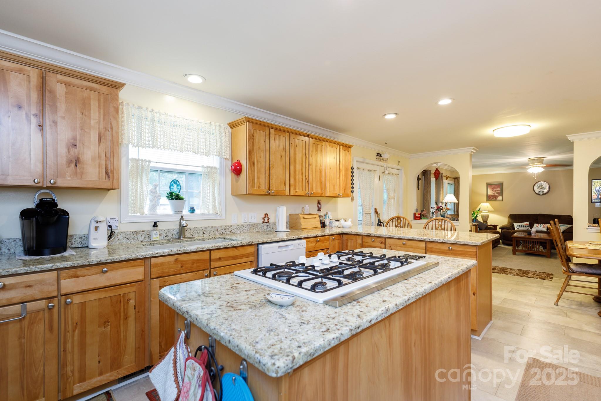 3199 Harmony Road Catawba, SC 29704 - Photo 8 of 46 a kitchen with stainless steel appliances granite countertop a stove top oven a sink dishwasher and cabinets with wooden floor