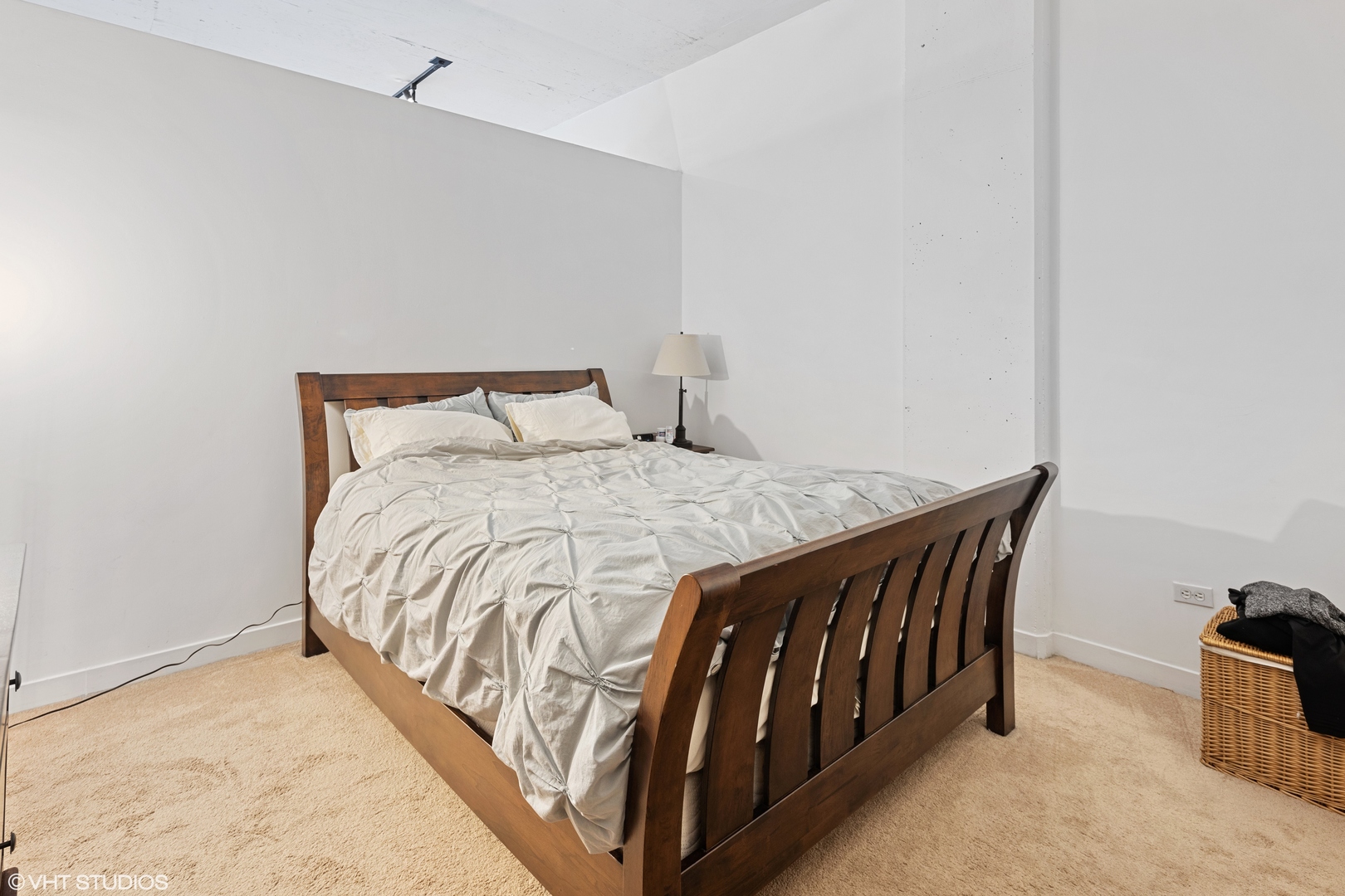 910 West Madison Street, Unit 603 Chicago, IL 60607 - Photo 13 of 15 a bed sitting in a bedroom next to a window